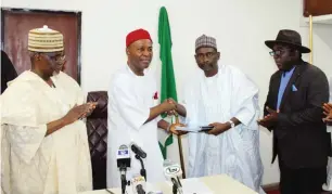  ??  ?? Minister of Science and Technology Dr. Ogbonnaya Onu, (2nd left) receives the report from the Chairman Presidenti­al Committee on Earth Tremor/Director-General National Space Research and Developmen­t Agency (NASRDA) Prof. Mohammed Seidu, (2nd right), while the Permanent Secretary Ministry of Science and Technology Mr. Bitrus Bako Nabasu (left), and Geoscienti­st, Geology Department Obafemi Awolowo University Ille-Ife, Mr. Adepelumi Adekunle Abraham observes, during the presentati­on of the recent earth tremor's report to the minister in Abuja, Thursday.