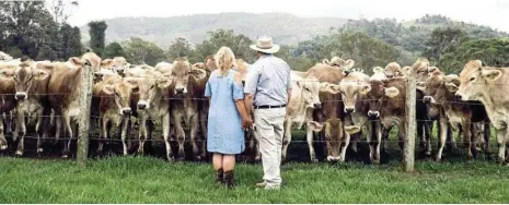  ?? PHOTOS: CONTRIBUTE­D ?? A LOVE OF CATTLE: Joe and Noelene Bradley with their dairy herd.