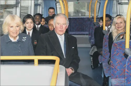  ?? PICTURE: GETTY IMAGES ?? THE ROYALS ON THE BUS: Prince Charles and the Duchess of Cornwall enjoy their outing on a double-decker bus in London despite the rain.