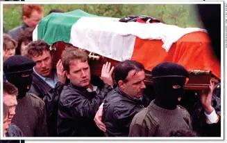  ?? ?? AMBUSH: The IRA guard of honour for Lawrence McNally, who was killed in Coagh by the SAS in 1991. Left, burnt-out cars after the mission