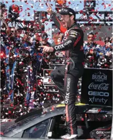  ?? AP PHOTO/D. ROSS CAMERON ?? Trackhouse Racing’s Daniel Suarez celebrates Sunday’s NASCAR Cup Series victory at California’s Sonoma Raceway.