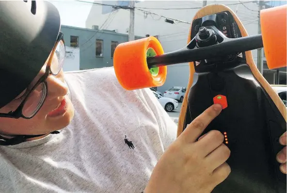  ??  ?? Daniel Dahlberg was riding his Boosted Board v2 down a hill in Kitsilano when he was stopped by police and fined $598 for riding a motorized skateboard on the road. He says he can’t return it to the shop that sold it to him because it’s been used.