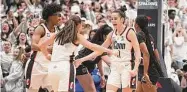  ?? Tyler Sizemore/Hearst Connecticu­t Media ?? UConn's Lou Lopez Senechal (11) celebrates a buzzer-beating 3-pointer against South Carolina on Feb. 5 in Hartford.