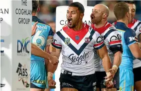  ?? GETTY IMAGES ?? Poasa Faamausili shows his delight at scoring on his NRL debut for the Sydney Roosters against the Gold Coast Titans.