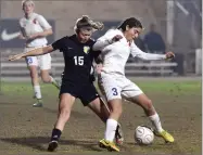  ?? RECORDER PHOTO BY CHIEKO HARA ?? Strathmore High School's Aliyah Garcia, right, attempts to dodge the Sierra Pacific High School defense Thursday during the second half of overtime at Spartan Stadium in Strathmore.