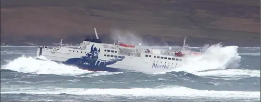  ??  ?? Heavy going: The MV Hamnavoe ferry ploughs through huge waves in the Hoy Sound after leaving Stromness, Orkney, yesterday