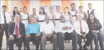  ??  ?? Minister within the Ministry of Social Protection Keith Scott (third from left), Regional Chairman, Region 3 Julius Faeber (second from left) and representa­tives of the BIT and the Leonora Technical & Vocational Training Centre surrounded by graduates...