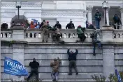  ?? JOSE LUIS MAGANA — THE ASSOCIATED PRESS ?? Supporters of President Donald Trump climb the west wall of the U.S. Capitol in Washington on Wednesday.