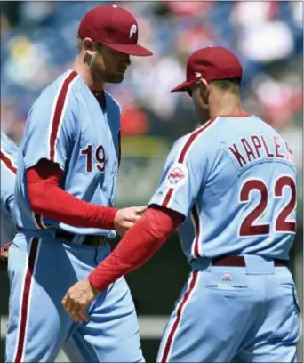  ?? DERIK HAMILTON — THE ASSOCIATED PRESS ?? Phillies starting pitcher Ben Lively, left, walks off the mound after he was pulled during the third inning by manager Gabe Kapler Thursday at Citizens Bank Park.