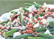  ?? ALYSHA WITWICKI ?? Blue cheese and pancetta add hearty flavors to this pretty salad.