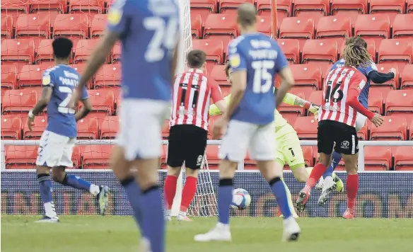  ??  ?? Alex Gilbey, obstructed, extends Charlton’s lead at the Stadium of Light.