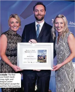  ??  ?? Accolade The Red House Hotel’s Sarah Ramsay, right, and colleague Lauren Fotheringh­am accept the award from Tom Lovering