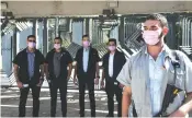  ?? ( Haim Zach/ GPO) ?? THE PRESIDENT’S bodyguards wear pink masks to signify cancer awareness.