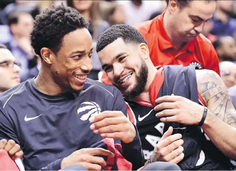  ?? FRANK GUNN/ THE CANADIAN PRESS ?? Raptors guards DeMar DeRozan and Fred VanVleet share a laugh late in their 133-99 rout of the Cleveland Cavaliers in Toronto, Thursday. The Raps, without starters Kyle Lowry and Serge Ibaka, got a career-high 22 points from VanVleet and a modest 13...