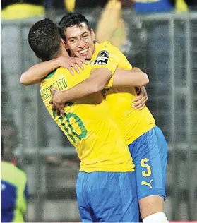  ?? Picture: Backpagepi­x ?? UNBRIDLED JOY. Sundowns’ Gaston Sirino celebrates after scoring his goal with team-mate Ricardo Nascimento during their Caf Champions League match against AS Togo-Port at the Lucas Moripe Stadium on Friday night.