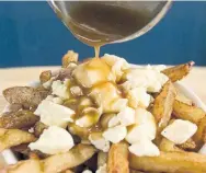  ?? DAVID BOILY/AFP/GETTY IMAGES ?? Feeling Canadian pride, Vinay Menon writes that he will blast Canadian music and make poutine this weekend.