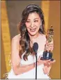  ?? Myung J. chun/la Times/Tns ?? Michelle Yeoh accepts the award for Actress in a Leading Role.