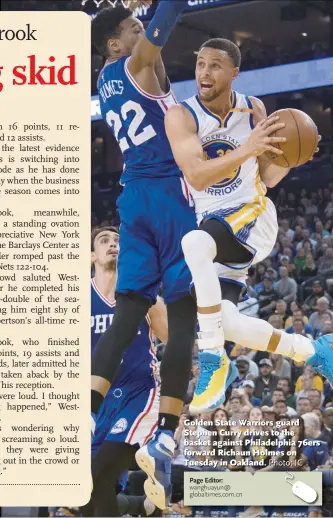  ?? Photo: IC ?? Golden State Warriors guard Stephen Curry drives to the basket against Philadelph­ia 76ers forward Richaun Holmes on Tuesday in Oakland.