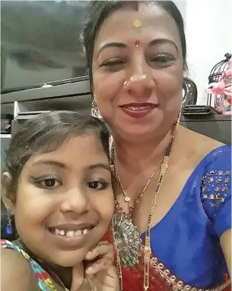  ?? Vijaylatch­mi Prasad (right) with her daughter, Navjita Prasad. ??