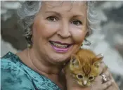  ?? ?? Lynn McKenzie with an orange tabby kitten friend.