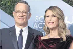  ?? Tom Hanks and Rita Wilson at the 26th Screen Actors Guild Awards, in Los Angeles. ?? RIGHT
Days after China shared the genome of the virus, Australia’s private testing industry — which handles everything from blood tests to stool samples — was mobilised, with the government making tests free through Medicare, the national healthcare plan.