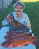  ?? Sue Whittaker was pretty happy with this nice haul of coral trout. ??