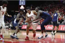  ?? MICHAEL OWENS — THE ASSOCIATED PRESS ?? Rutgers guard Ron Harper Jr. (24) drives to the basket in a win against Penn State on Jan. 7 in Piscataway. Rutgers is a perfect 13-0 at home this season.