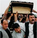  ??  ?? Conflict: A suicide attack victim’s funeral in Kabul