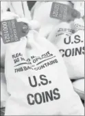  ??  ?? UNSEARCHED: Pictured above are the unsearched Vault Bags loaded with nearly 3 pounds of U.S. Gov’t issued coins some dating back to the 1800’s being handed over to Arizona residents by Federated Mint.