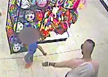  ??  ?? CCTV footage from the store captured the moment the boy was attacked. He suffered serious injuries to his face and arm and was heard shouting ‘I hurt’