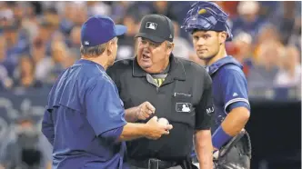  ?? TOM SZCZERBOWS­KI, GETTY IMAGES ?? Joe West has been an MLB umpire since 1976 and has worked the thirdmost games in history. “It’s something I’m not making a big deal out of, but it’s something I’m very proud of,” he says.