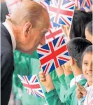  ??  ?? HRH the Duke of Edinburgh meeting groups of children outside Slough Railway Station — 175 years to the day after Queen Victoria became the first British monarch to travel by train in 1842. The Queen and duke recreated the journey to London on June 13, 2017.