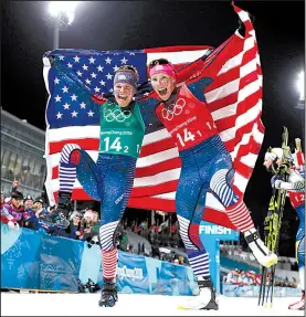  ?? AP/MATTHIAS SCHRADER ?? Jessica Diggins (left) and Kikkan Randall of the United States celebrate after winning the gold medal in the women’s team sprint freestyle cross-country skiing event Wednesday. It was the first time Americans have earned a cross-country skiing medal...