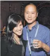  ?? Michael Kovac Getty Images ?? Jennifer “Mimi” Pham and Zappos CEO Tony Hsieh attend a Vanity Fair event in 2014 in San Francisco.