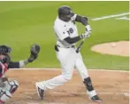  ?? GETTY IMAGES ?? Luis Robert hits a single in the seventh inning Friday against the Indians.