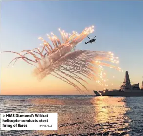  ?? LTCDR Clark ?? > HMS Diamond’s Wildcat helicopter conducts a test firing of flares