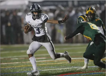  ?? KARL MONDON — BAY AREA NEWS GROUP, FILE ?? Marin Catholic's Charles Williams Jr. (3) stiffs-arm his way into the end zone for a touchdown against San Ramon Valley in the first quarter of the CIF State Division 2-A regional final on Dec. 3 in Danville.