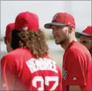  ?? THE ASSOCIATED PRESS FILE PHOTO ?? Chris Sale stands with teammates during a workout.