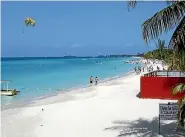  ?? ISTHATITSM­E / BUDGET TRAVEL ?? Jet-skiers and sunbathers enjoy Seven Mile Beach in Negril.