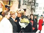  ??  ?? Diana gives flowers to June Kenton in 1996