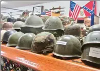  ?? (Special to the Democrat-Gazette/Marcia Schnedler) ?? Helmets from World War II and other conflicts are part of the collection at the Museum of Veterans and Military History.