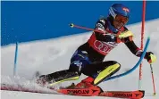  ?? Alessandro Trovati/Associated Press ?? United States’ Mikaela Shiffrin speeds down the course during an alpine ski women’s World Cup slalom Sunday in Are, Sweden.
