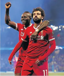  ?? /Reuters ?? Red alert: Mohamed Salah, right, celebrates scoring against Manchester City in the Champions League quarterfin­al with Sadio Mane, who says he is lucky to be in the same team as Salah.