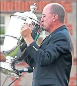  ??  ?? Nigel Edwards raises the Walker Cup at Royal Lytham four years ago