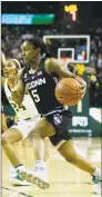  ?? Ray Carlin / Associated Press ?? UConn guard Crystal Dangerfiel­d works her away around Baylor guard Chloe Jackson during the first half on Thursday.