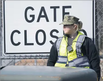  ?? NAS PATUXENT RIVER PHOTO ?? A sailor stands guard at Naval Air Station Patuxent River’s Gate 2 during a security exercise. In the event of an emergency, inclement weather, or for day-to-day operationa­l info, knowing where to go for base informatio­n is critical for all personnel on base.