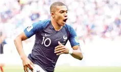  ??  ?? France’s forward Kylian Mbappe celebrates after scoring their third goal during the Russia 2018 World Cup round of 16 football match between France and Argentina at the Kazan Arena in Kazan on June 30, 2018.