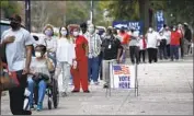  ?? Michael Holahan Augusta Chronicle ?? GEORGIANS wait in a long line at a polling place in Augusta on Oct. 12, the first day of early voting.