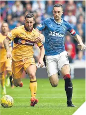  ??  ?? Scott McDonald battles with Lee Wallace.