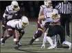  ?? OWEN MCCUE - MEDIANEWS GROUP ?? Former Pottstown players Owen Morton (14) and Cole Miller (69) line up on the Alvernia offensive line Friday night at Ursinus